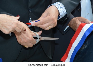 French ribbon ( Inauguration ) cut with a pair of scissors