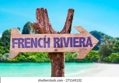 French Riviera Wooden Sign With Beach Background