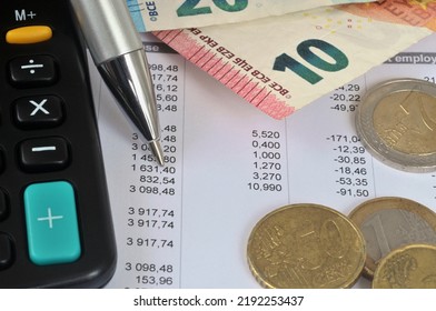French salary slips with euros and a calculator - Shutterstock ID 2192253437