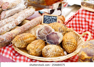 French Saucissons And Ham Display In Market In South Of France, Arles, Provence. Local Organic Food.