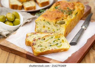 French savoury cake with olives, zucchini, ham, sweet pepper and cheese - Shutterstock ID 2162792409