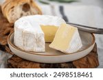 French soft Camembert cheese, original Camembert de Normandie made from raw unpasteurised cow milk