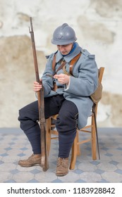 A French Soldier 1914 1918, Sitting On Chair, Reading Letter