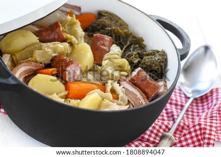 french speciality, the cabbage hotpot on a cooking pot on a white wooden table