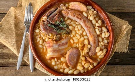 french speciality : the cassoulet, a meal with white beans , duck leg, sausage and bacon - Shutterstock ID 1801808221