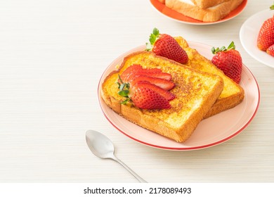 french toast with fresh strawberry on plate
