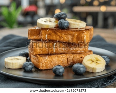 French Toast Stack with Fruit breakfast photography, french toast, banana slices, blueberries, maple syrup, black plate, brunch treat