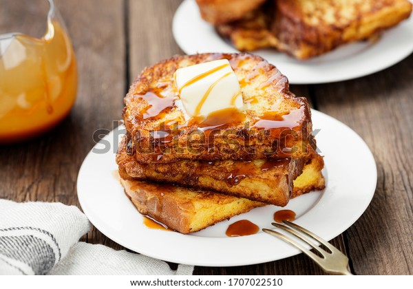 French toasts with butter and caramel sauce\
for breakfast.