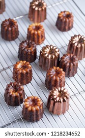 French Traditional Dessert Canele On The Pastry Lattice For Glazing