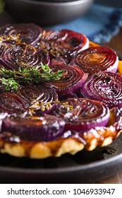 French Traditional Rustic Onion Tarte Tatin With Balsamic Vinegar, Caramel And Provence Herbs