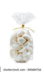 French White Meringues In A Cellophane Bag, Isolated On White Background