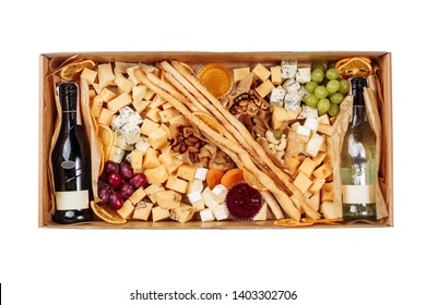 French Wine Cheese Carton Box Isolated Delivery. Gourmet Italian Fruit And Drink Set In Paperboard Gift Package On White Background. Beverage Bottle And Variety Nut Snack For Party. Big Cheeseboard