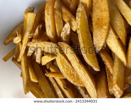 Frenchfries closeup background. Fried and ready to eat.