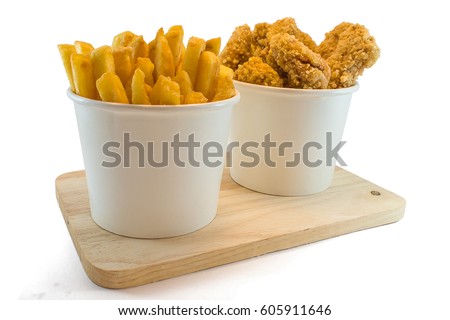 Frenchfries and nuggets in paper boxes on white background