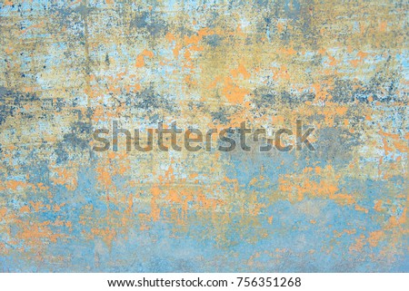 Fresco background - Background of an old wall with peeled faded paint in yellow and blue colors. It looks like as part of an ancient mural painting.