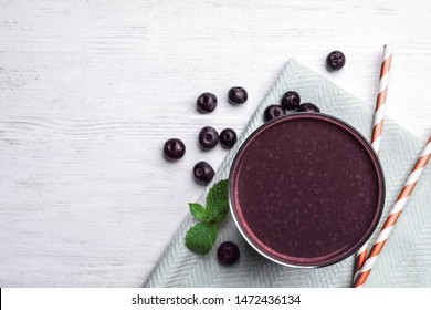 Fresh Acai Drink And Berries On White Wooden Table, Flat Lay. Space For Text