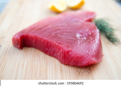 Fresh Ahi Tuna Steak On Wooden Board 