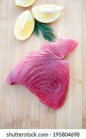 Fresh Ahi Tuna Steak On Wooden Board 