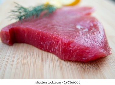 Fresh Ahi Tuna Steak On Wooden Board 