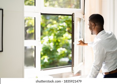 Fresh Air From Window. Side View Of Man Relaxing