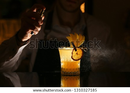 Fresh alcohol Penicillin cocktail with orange slice and ice cubes