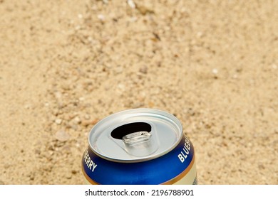 Fresh Alcoholic Drink In A Can On Holiday. Summer Vibe. Fiesta. Chilling At The Beach. Canned Pop Soda. Cold Canister. Drinking Beer. Vacation. Time Off. Alcohol. Pollution. Trash On Sand.Spring Break