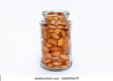 Fresh almond nuts into glass jar isolated on white background - Powered by Shutterstock