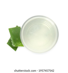Fresh aloe drink in glass and leaf slices on white background, top view