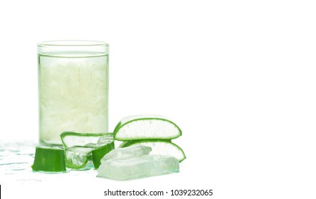 Fresh aloe vera leaves and glass of aloe vera juice healthy drink isolated on white background.