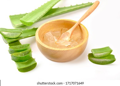  Fresh Aloe Vera and  sliced with gel in wooden bowl on white background.
