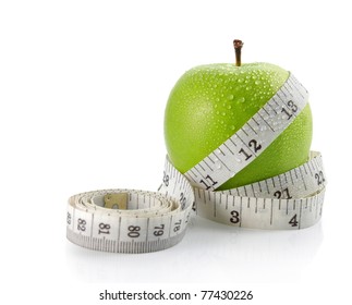 fresh apple with measuring tape. isolated over white background - Powered by Shutterstock