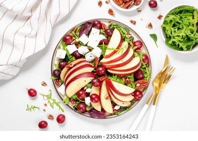 Fresh Apple Salad with Grapes, Pecans, Arugula and Feta, Fall Salad on Bright Background, Comfort Food - Powered by Shutterstock