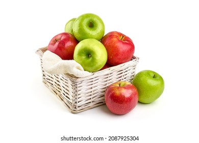 Fresh apples in basket, isolated on white background