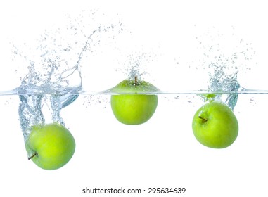 Fresh Apples Falling Into Water With Splashes