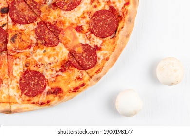 Fresh Aromatic Hot Pepperoni Pizza With Salami Sausage And Mushrooms On White Background