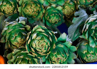 fresh artichokes at a farmers market, fresh vegetable stall, vegetable store, artichoke hearts, green vegetables for healthy diet - Shutterstock ID 2281812159