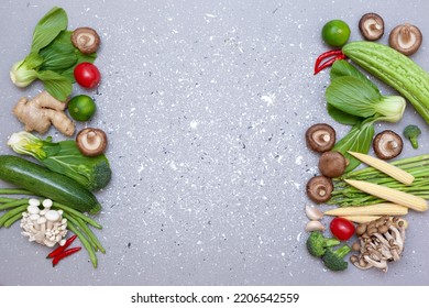 fresh asian groceries : pak choy, baby corn, mushrooms and spices on a gray background. view from above. copy space - Shutterstock ID 2206542559