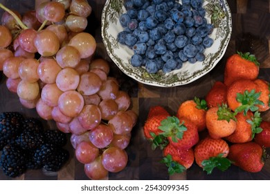 Fresh Assorted Berries and Grapes on a Wooden Board - Powered by Shutterstock