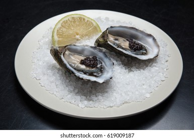 Fresh Australian Oysters On Plate Served With Lemon