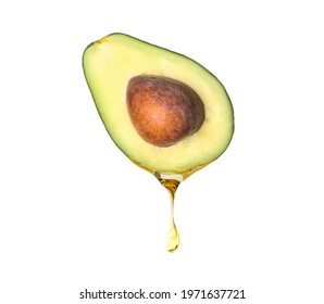 Fresh Avocado With Dripping Oil On White Background