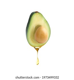 Fresh Avocado With Dripping Oil On White Background