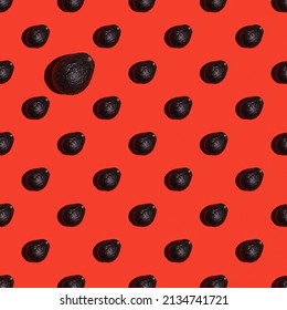 Fresh avocado pattern on bright red background. Pop art design, creative summer food concept. Top view, banner or endless pattern. Avocado haas ingredients for guacamole, minimal flat style.