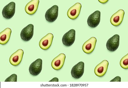 Fresh avocado pattern on light green background, top view, flat lay - Powered by Shutterstock