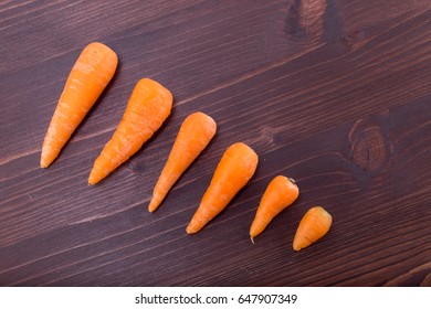 Fresh Baby Carrots Diagonal On A Natural Ipe Wood Table