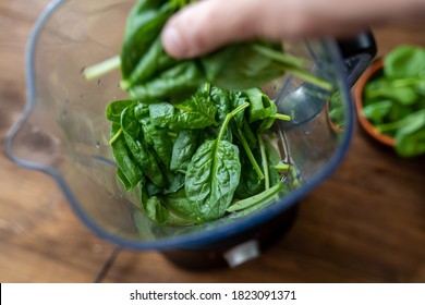 Fresh Baby Spinach Leaves In A Blender. Making A Green Smoothie