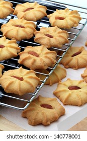 Fresh Baked Almond Butter Cookies On Wire Rack And Baking Parchment