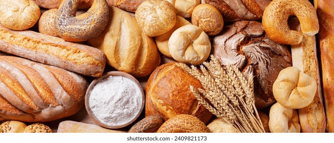 Fresh baked bread, flour and wheat ears as background, top view - Powered by Shutterstock