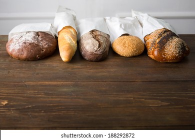 Fresh Baked Bread At Wooden Table