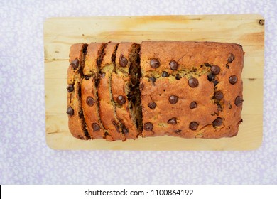 Fresh Baked Chocolate Chip Banana Bread On Wooden Board Shot From Overhead