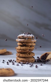 Fresh Baked Chocolate Cookies Sprinkled By Chocolate Crumble And White Powder Sugar Cane In White Background Marble Texture